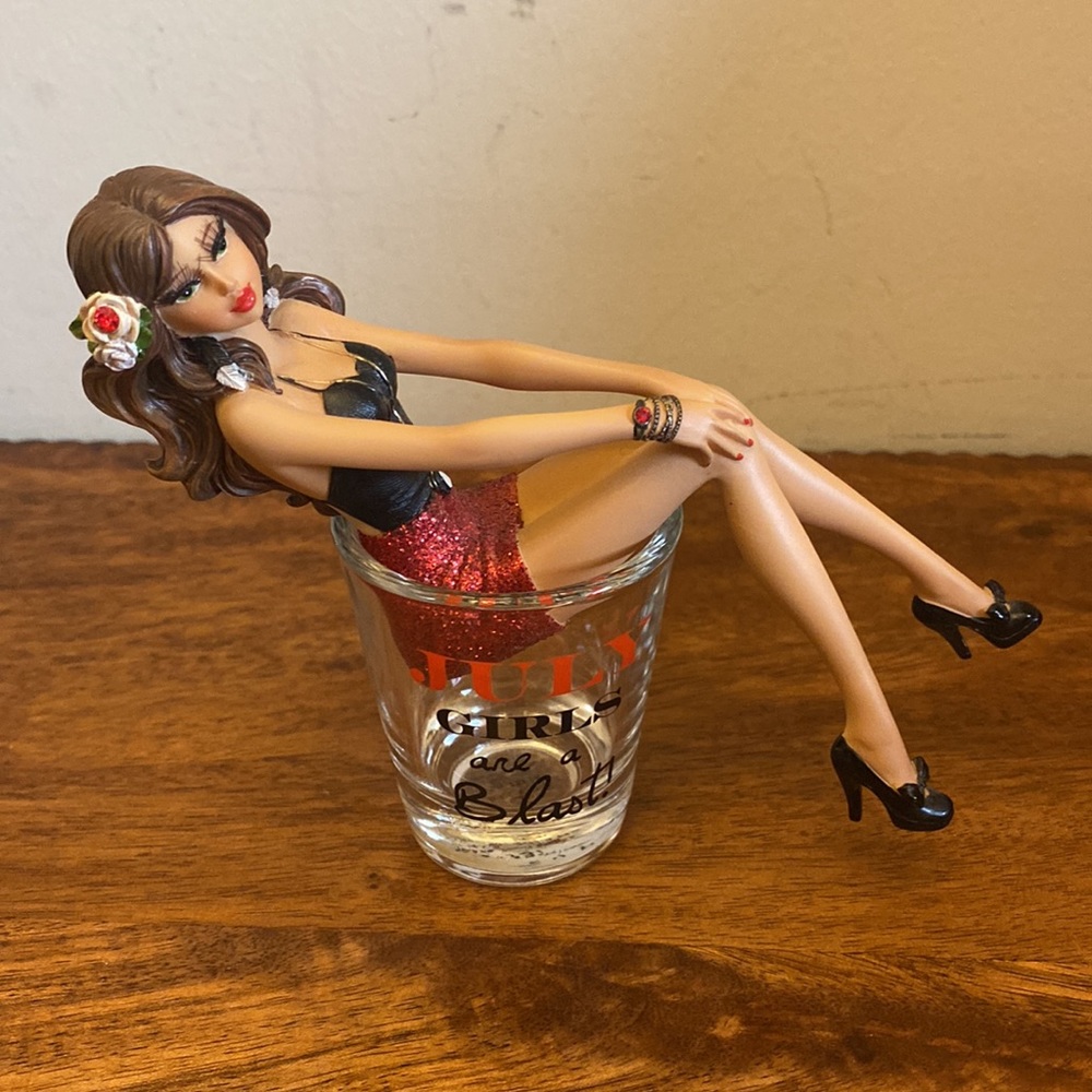 NWOT. “July Girls” shot glass with porcelain lady.